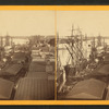 Down the River. [View of sailing vessels.]
