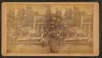 4th of July [1896] celebration in Marengo showing clowns with cannon, simple ferris wheel.