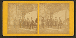Group portrait of men in front of a tent.