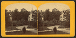 Winding path leads to church set among trees.