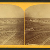 General view of Hope, Indiana, farm with plowed fields in the foreground.