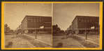 People in front of a meat store, Davenport, Iowa.