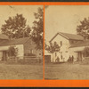 Couple sitting in front of their home, Waterloo, Iowa.