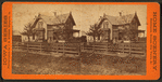Couple sitting in front of their home with child standing, Waterloo, Iowa.