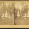 Group of men and women relaxing in a garden.