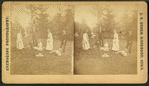 Group of men and women relaxing in a garden.