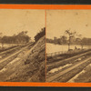 Railroad tracks and Coon River west of city.