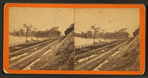 Railroad tracks and Coon River west of city.