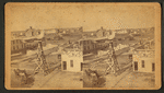 General view of Great Bend showing wind mill, implement store, homes, other buildings.
