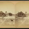 Family in front of a sod house.