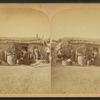 Family in front of a sod house.