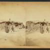 Three people in front of a sod house.
