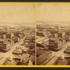 General bird's-eye view showing buildings, houses, and the river.