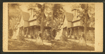 Two women in the yard of a home, including Mrs. Morris.