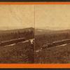 [A view of a train in the western Maryland hills.]