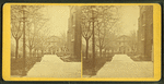 In front of the chapel, showing the library in the background.