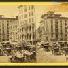 Monument square [full of carriages, showing hotels and the monument].