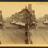 Baltimore street[looking west. Commerical buildings with awnings].