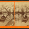 A main and child in flat bottomed boat.