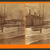 View of a house in the winter showing ice on the ground.