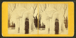 A boy standing inside a frozen fountain, Chicopee Falls.