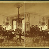 Mr. & Mrs. Marcus H. Rogers in their parlor on the 2nd floor of the "Berkshire Courier" building, furniture, light fixtures, layout of rooms visible.