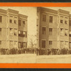 Large group of people in front of a building.