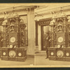 Wm. Hawes in front of jewelry store with intricate clock.