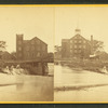 Westbrook Manufacturing Company, showing buildings on a river and part of a bridge.