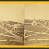 General view of Princeton showing roads, a church, and homes.