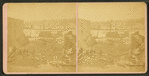 Men standing among debris of a ruined building in Southbridge.