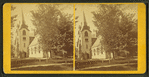 View of a church, obscured by trees.