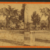 View of residential street with buggy and trees.