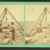 Men building a stone wall.
