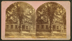 Decorations for a centennial celebration with an arch reading "1778 Welcome 1878" near a building decorated with banners.