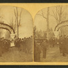 Triumphal arch over road to the battle ground.