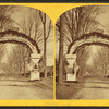 Triumphal arch over road to battle ground.