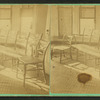 Interior view showing two chairs and a settee.