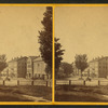Upper Main St. showing commons in foreground, 4-story buildings beyond.