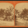 View of residence with white fence.