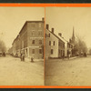 Street view showing commercial buildings and church.