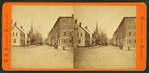 Street view showing commercial buildings and church.
