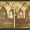 An interior view of a church on its twentieth anniversary in 1879 showing decorations.