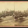 Buildings along the Merrimack River totally destroyed except for the chimneys.