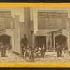 Near view of central shaft building, eng'rs at work.