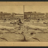 Connecticut River Dam at low water, boys posing on rocks in foreground.