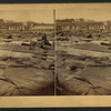 Connecticut River Dam at low water, boys posing on rocks in foreground.