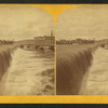 Water pouring over a dam.
