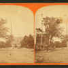 View of common(?) showing flagpole and church in the distance.