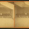 Studio view of 50 children in Revolutionary era outfits.